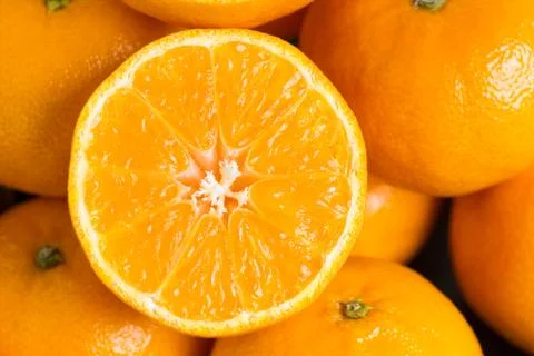 Slice of mandarin Stock Photos
