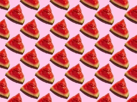 Slice of Mini Watermelon pattern on a pink background with a hard shadow Foto stock