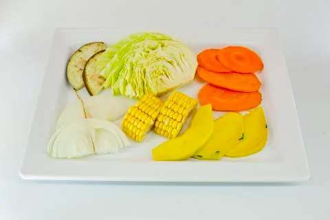 Slice Mixed vegetables  on white dish isolate Stock Photos
