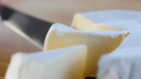 A slice of moist, soft, creamy, surface-ripened cow's milk cheese Vídeo Stock 151869930