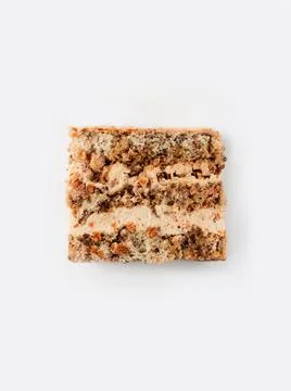 Slice of nuts cake. Top view. Stock Photos