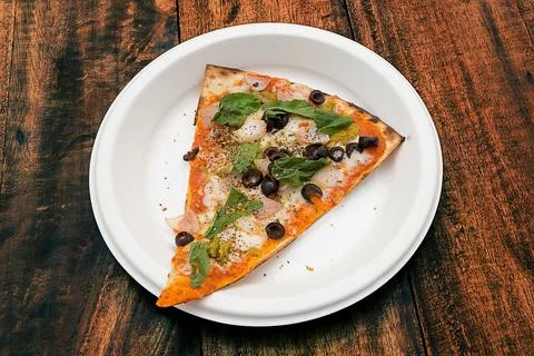 A slice of olive pizza Stock Photos
