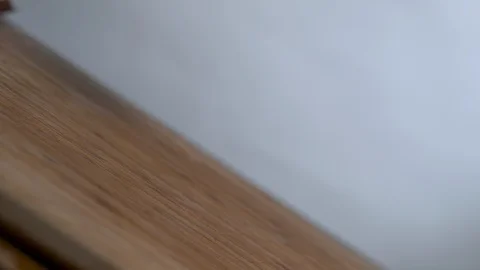 Slice onion falls on the chopping board in slow motion Stock Footage 100008646
