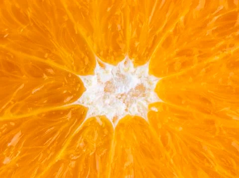 Slice of orange close-up. Orange texture for designers. Foto stock