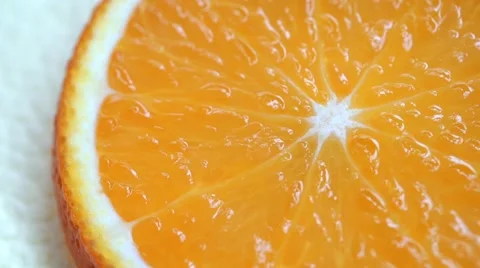 Slice of orange fruit rotation on white background 動画素材 61777313