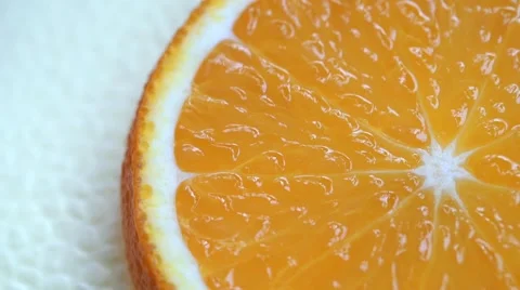 Slice of orange fruit rotation on white background Video stock 61777543