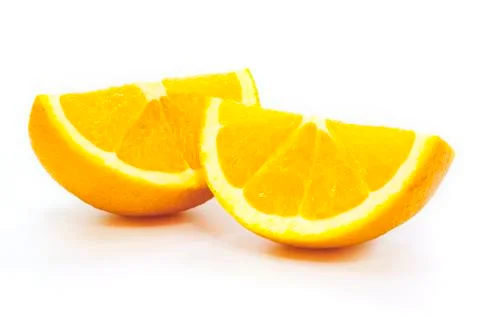 Slice of orange on white. Stock Photos