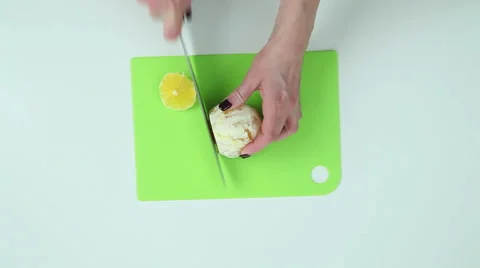 Slice the oranges with a knife Stock Footage 60450386