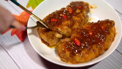 Slice Pan-Fry Chicken on the Disk Stock Footage 243469423