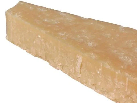Slice of parmesan isolated on white Фото