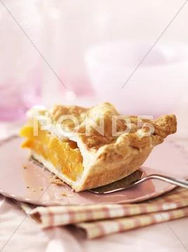 A slice of peach pie Stock Photos