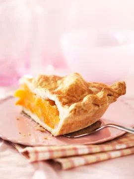 A slice of peach pie Stock Photos