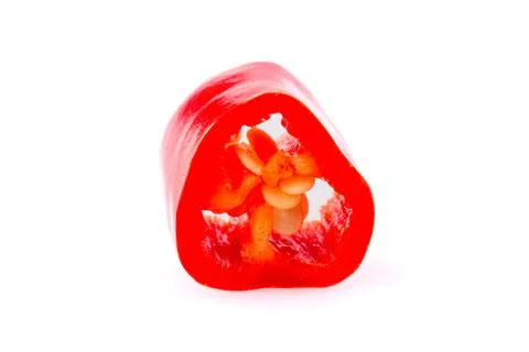 A slice of pepper on a white background. Close-up of a cut pepper isolated .. Stock Photos