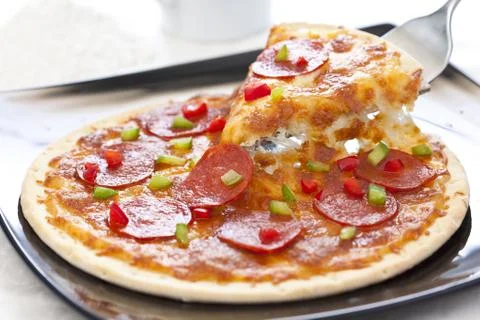 Slice of pepperoni pizza Stock Photos