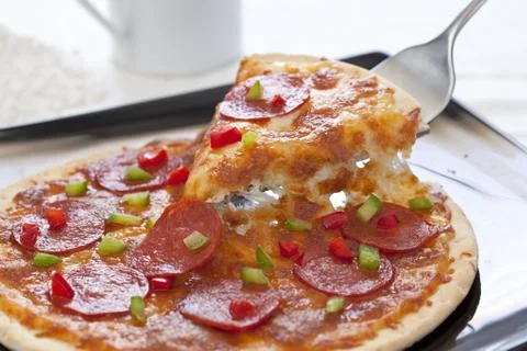 Slice of pepperoni pizza Stock Photos