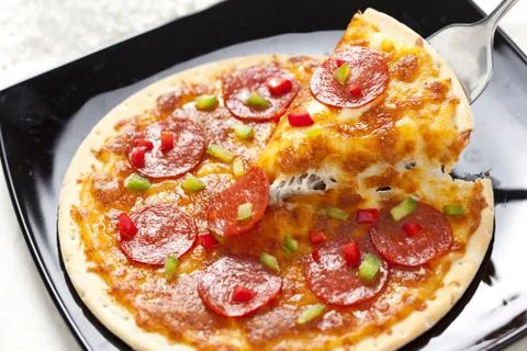 Slice of pepperoni pizza Stock Photos