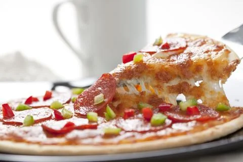Slice of pepperoni pizza Stock Photos