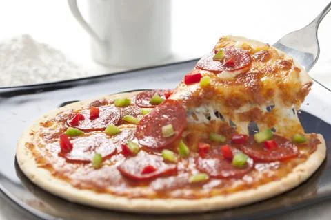 Slice of pepperoni pizza Stock Photos