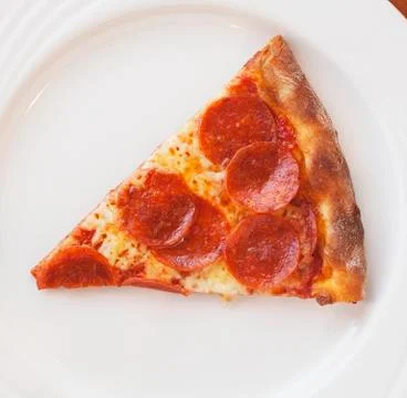 A slice of pepperoni pizza Stock Photos