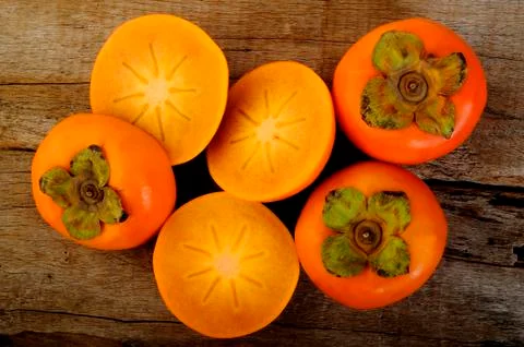 Slice persimmon Stock Photos