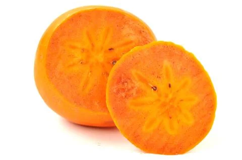 Slice persimmon on a white background Stock Photos