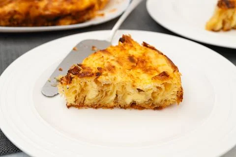 Slice of Phyllo dough pie with cream cheese filling close-up Stock Photos