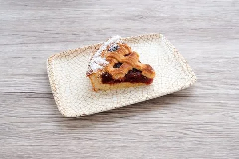 A slice of pie is on a white plate Stock Photos