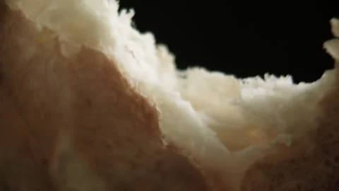 To slice a piece of bread close-up. Bread is breaking Stock Footage 131956740