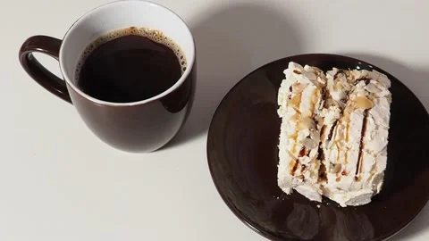 Slice piece of vanilla cake topping with white chocolate chips for coffee or tea Stock Footage 145303925