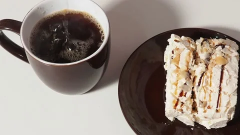 Slice piece of vanilla cake topping with white chocolate chips for coffee or tea Stock Footage 145303939