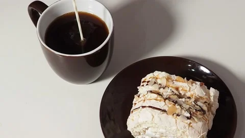 Slice piece of vanilla cake topping with white chocolate chips for coffee or tea Vidéo 145303951