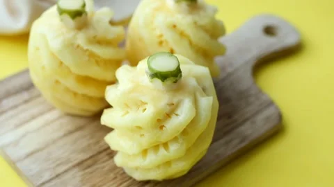 Slice of pineapple in bowl on table 스톡 동영상 233862496