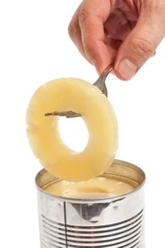 Slice of pineapple on a fork Foto stock