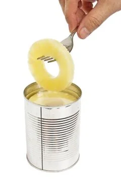 Slice of pineapple on a fork Stock Photos