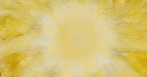 Slice pineapple rotates slowly. Macro background. Stock Footage 129800711