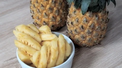 Slice of pineapple on a white bowl 動画素材 105385773