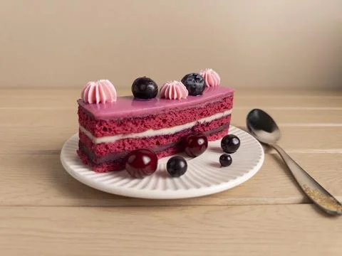 Slice of Pink Layer Cake with Berries on Plate Stock Photos