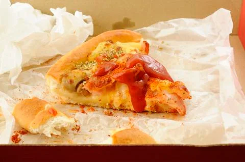 Slice of pizza in the box Stock Photos