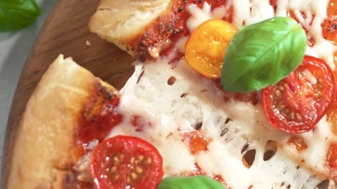 A slice of pizza with melted mozzarella cheese. 4K Footage Stock Footage 232986613
