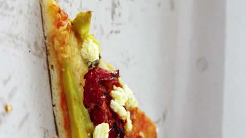 Slice of pizza with missing bite in pizza box 스톡 동영상 300931304