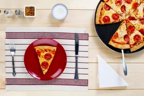 Slice of pizza on plate Stock Photos