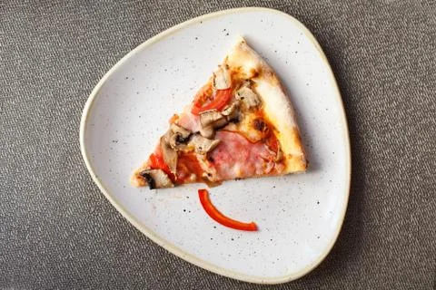 Slice of pizza on plate. Stock Photos