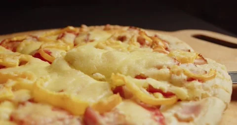 A slice of pizza is separated and the melted cheese is stretched. An appetizing Stock Footage 277419780