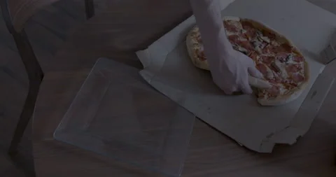 A Slice of Pizza is Served from the Box to a Plate Stock Footage 153816531