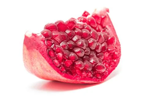 A slice of pomegranate on white background Stock Photos