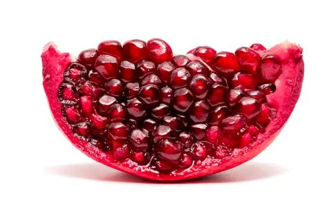 A slice of pomegranate on white background Stock Photos