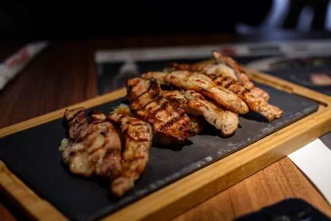 Slice of pork meat cooked in bbq. Stock Photos