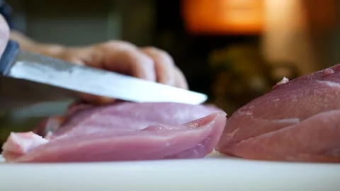 Slice pork meat with a knife Stock Footage 144878301