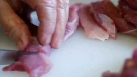 Slice pork meat with a knife Stock Footage 144883617