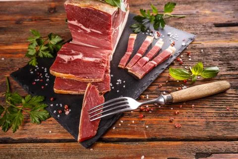 Slice of prosciutto Stock Photos
